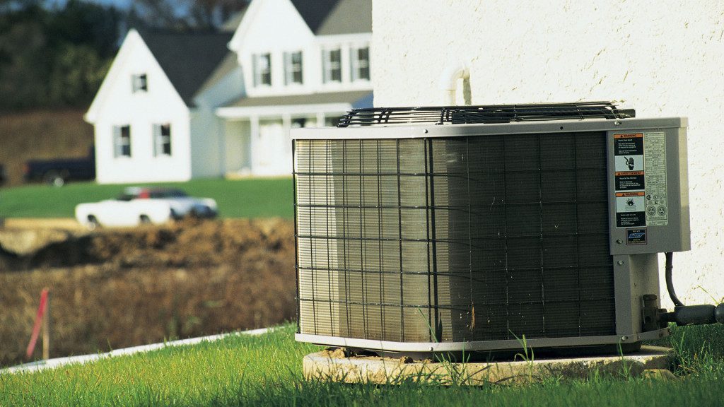 A person fixing an HVAC system 