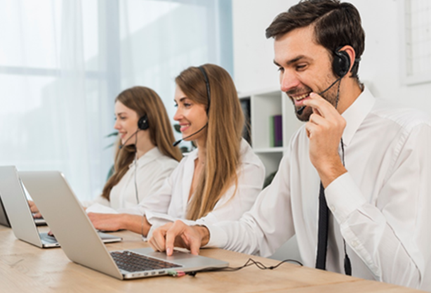Group Of Phone Answering Service Agents Answering Calls 
