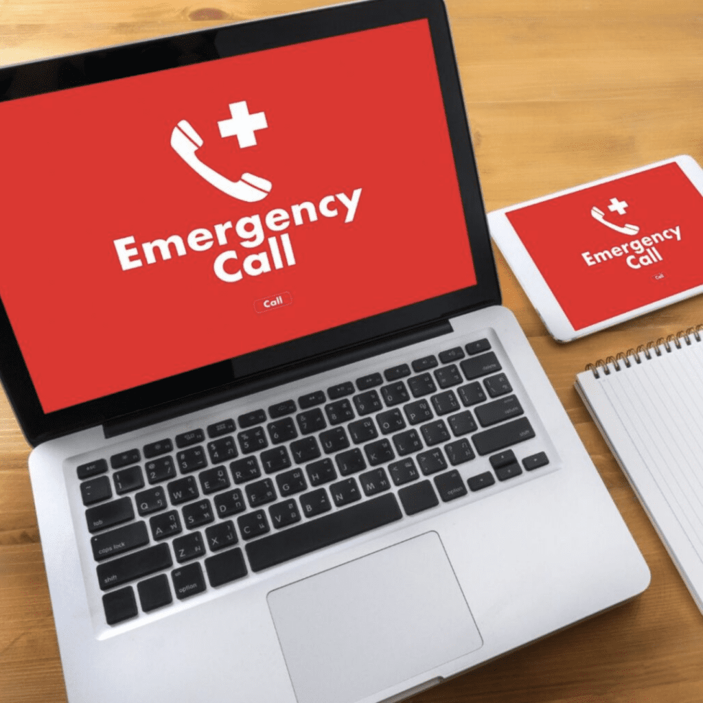 A laptop screen showing text that says “emergency call”