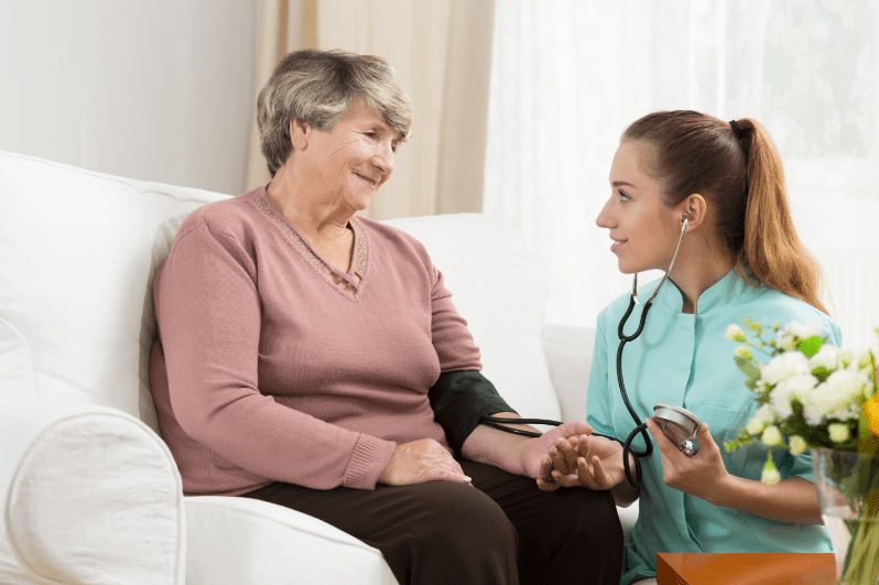 Nurse with a female elderly patient