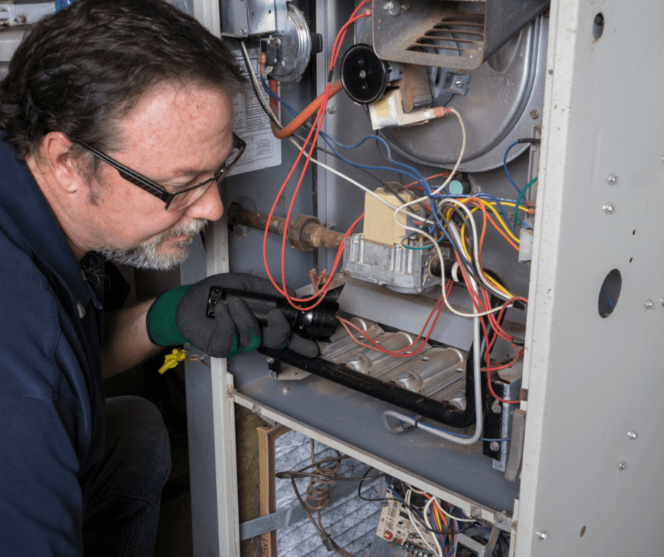 A person fixing an HVAC system