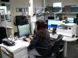 An Answering Service Agent working at Anserve Office