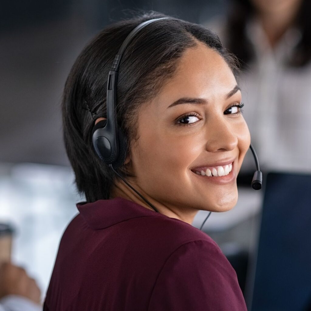 An answering service agent smiling